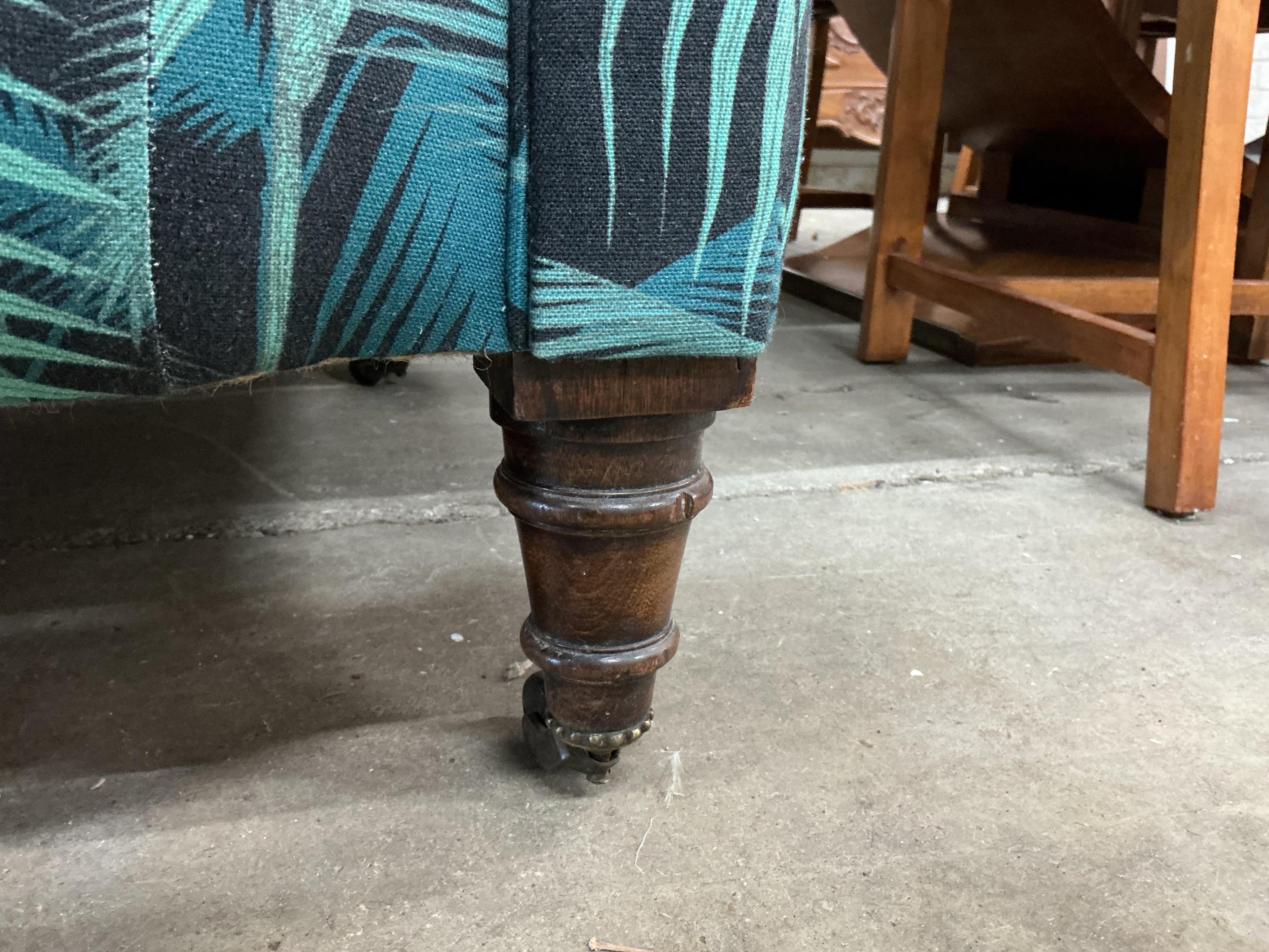 A late Victorian upholstered Chesterfield settee, width 190cm, depth 80cm, height 75cm